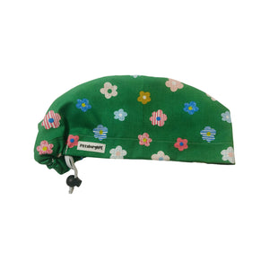 Textured flowers on green scrub cap