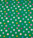 Textured flowers on green scrub cap